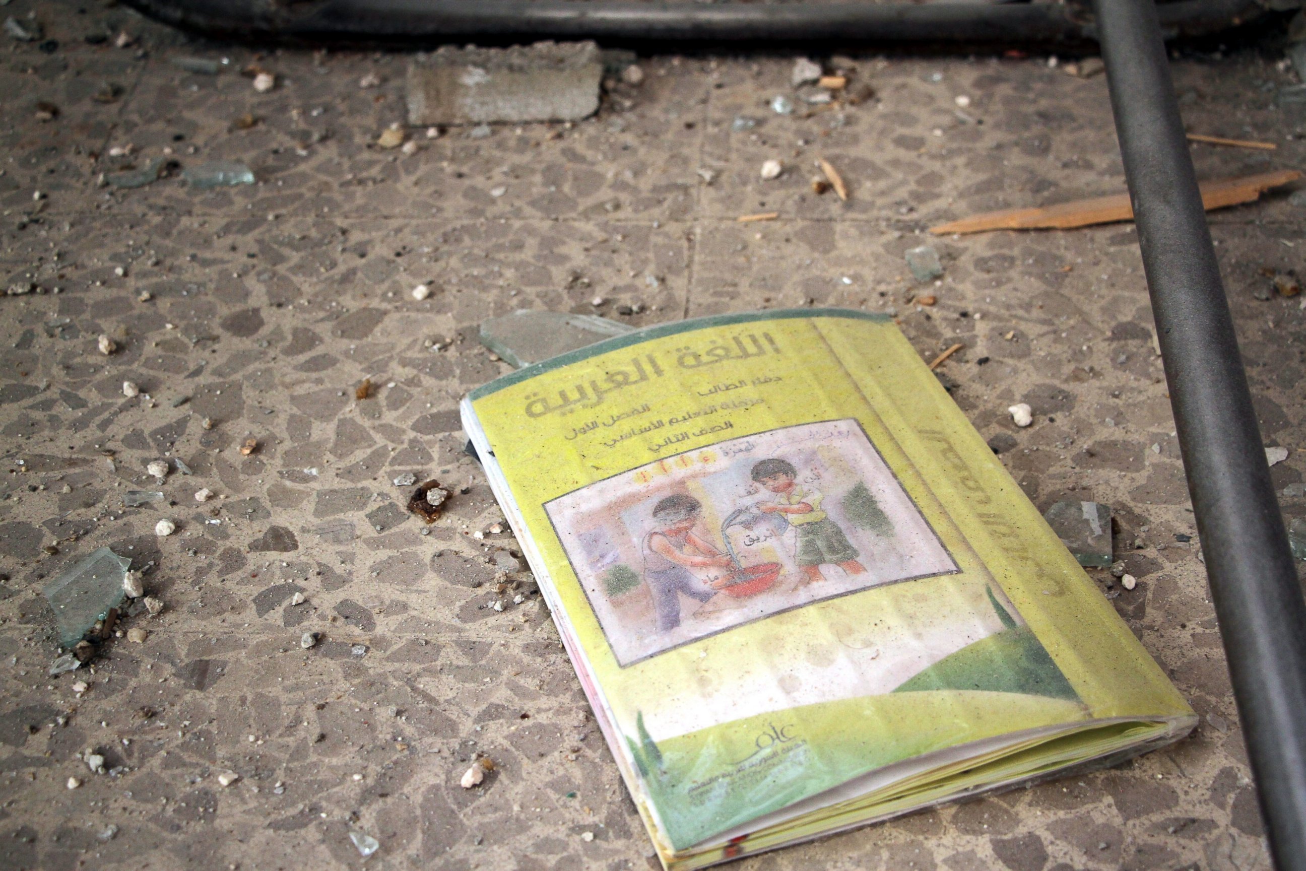 PHOTO: An Arabic language book lays on the ground at a school that was bombed a day earlier in rebel-held Idlib, Syria, Oct. 27, 2016.