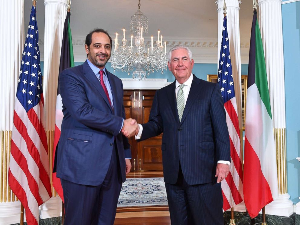 PHOTO: Secretary of State Rex Tillerson (R) posing for a photo with Kuwaiti Minister of State for Cabinet Affairs and Acting Minister of Information, Sheikh Mohammad Abdullah Al-Sabah (L). 