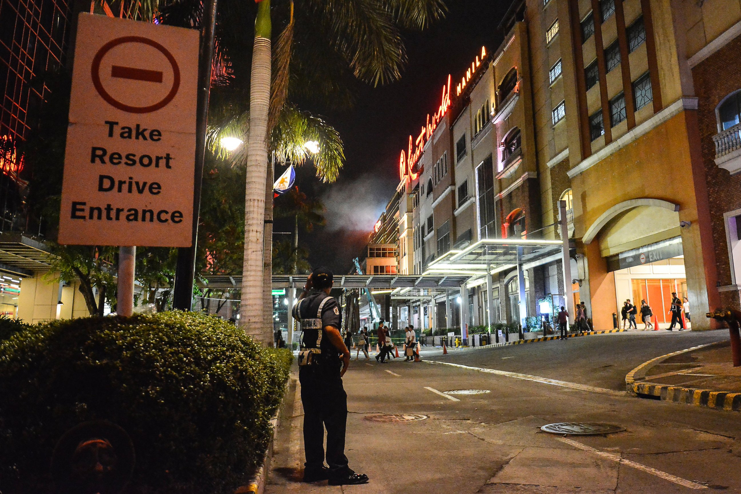 PHOTO: A Filipino policeman stands guard outside the Resort World Manila hotel in Pasay City, Philippines, June 2, 2017.