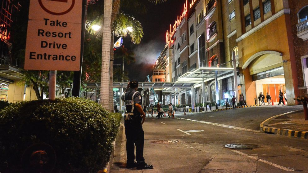 PHOTO: A Filipino policeman stands guard outside the Resort World Manila hotel in Pasay City, Philippines, June 2, 2017.