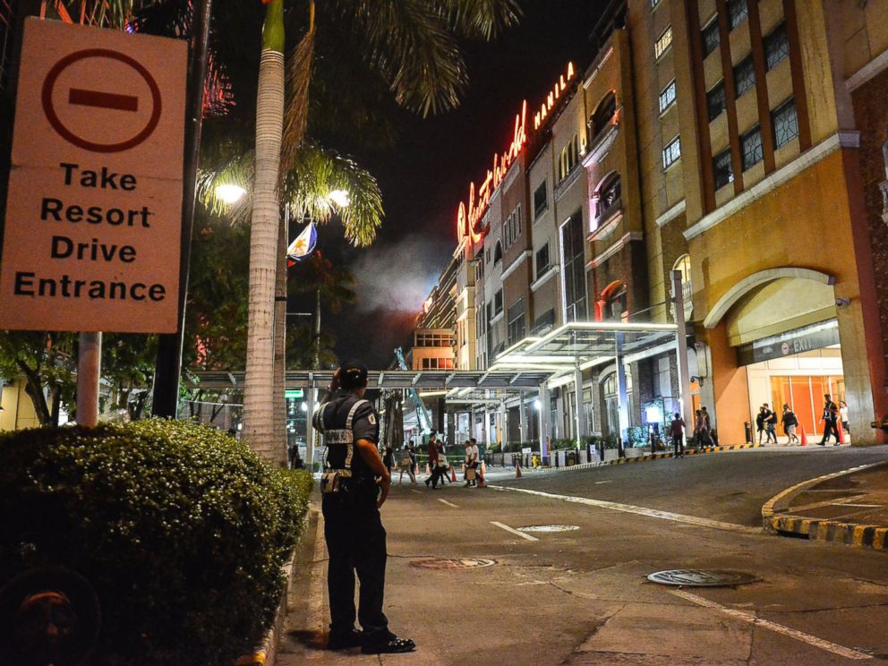PHOTO: A Filipino policeman stands guard outside the Resort World Manila hotel in Pasay City, Philippines, June 2, 2017.