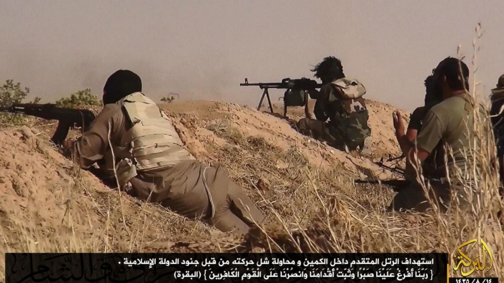 PHOTO: A photograph released by the jihadist affiliated group Albaraka News allegedly shows fighters from the Islamic movement ISIS aiming at advancing Iraqi troops at an undisclosed location near the border between Syria and Iraq, 12 June 2014.