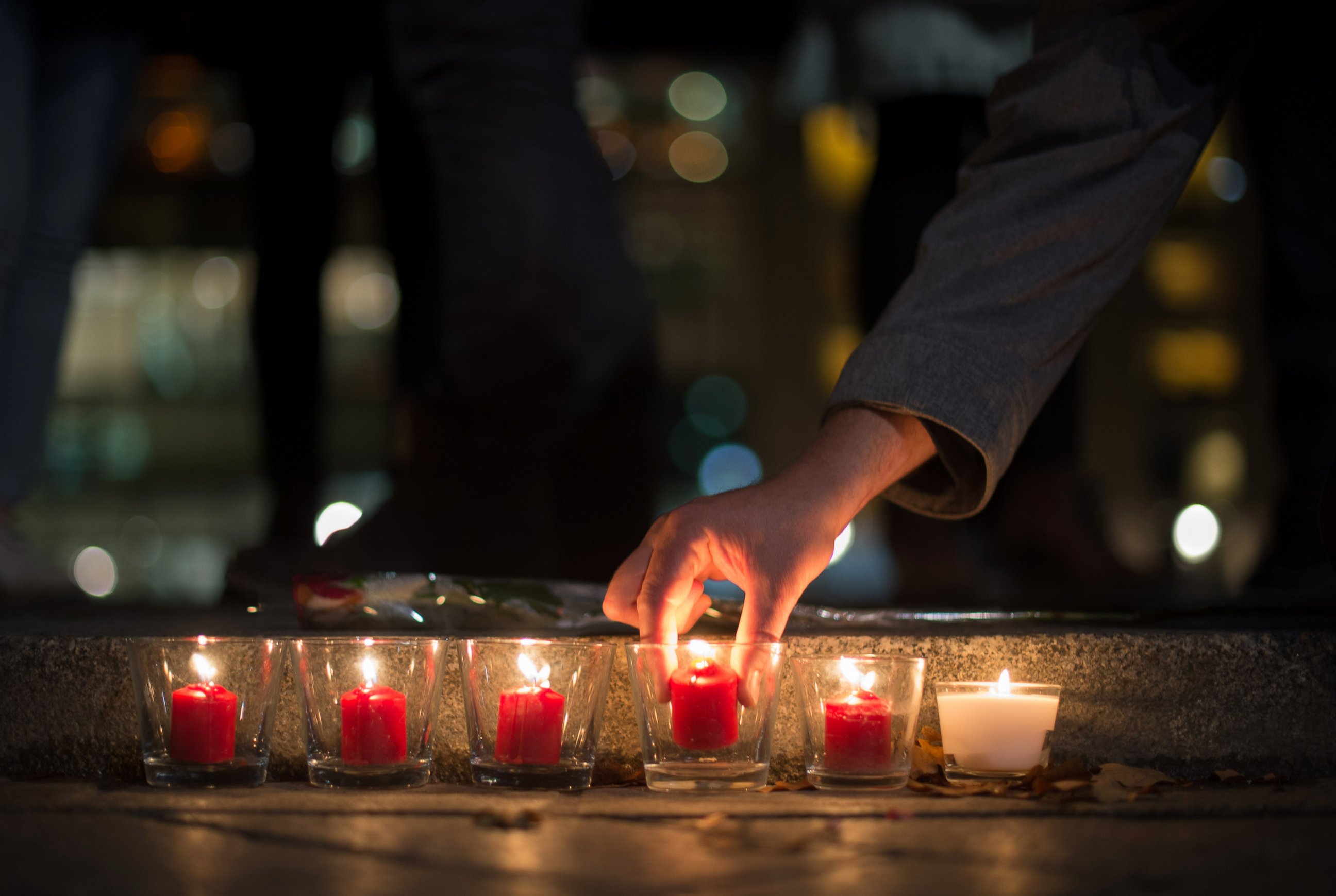 PHOTO: People light candles in tribute to the victims of the Paris attacks, outside the French embassy in Berlin on Nov. 13, 2015.