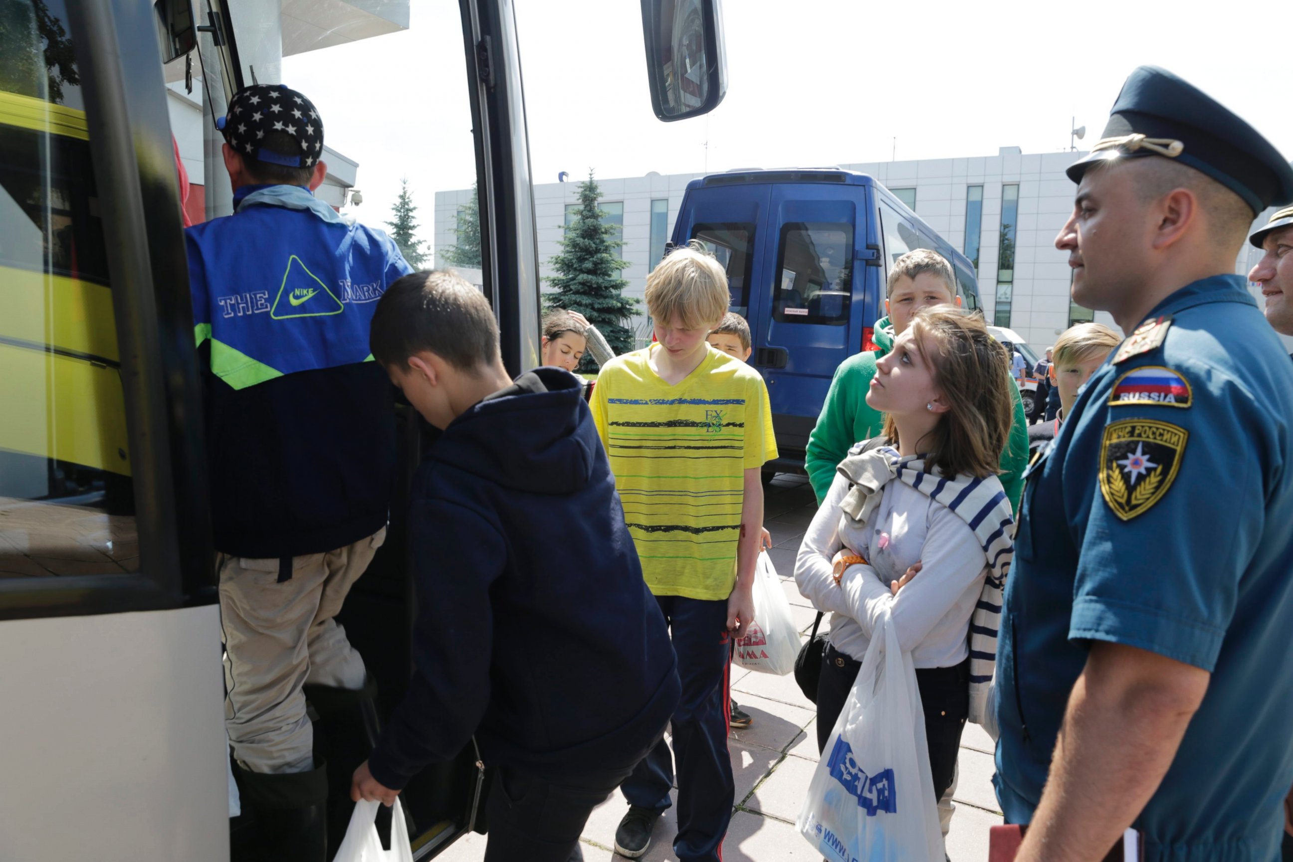 PHOTO: A picture released by the Russian Emergency Ministry shows Russian children embarking on a bus after arriving in Moscow, Russia, on June 20, 2016 from a tourist camp at the lake of Syamozero in the Republic of Karelia.