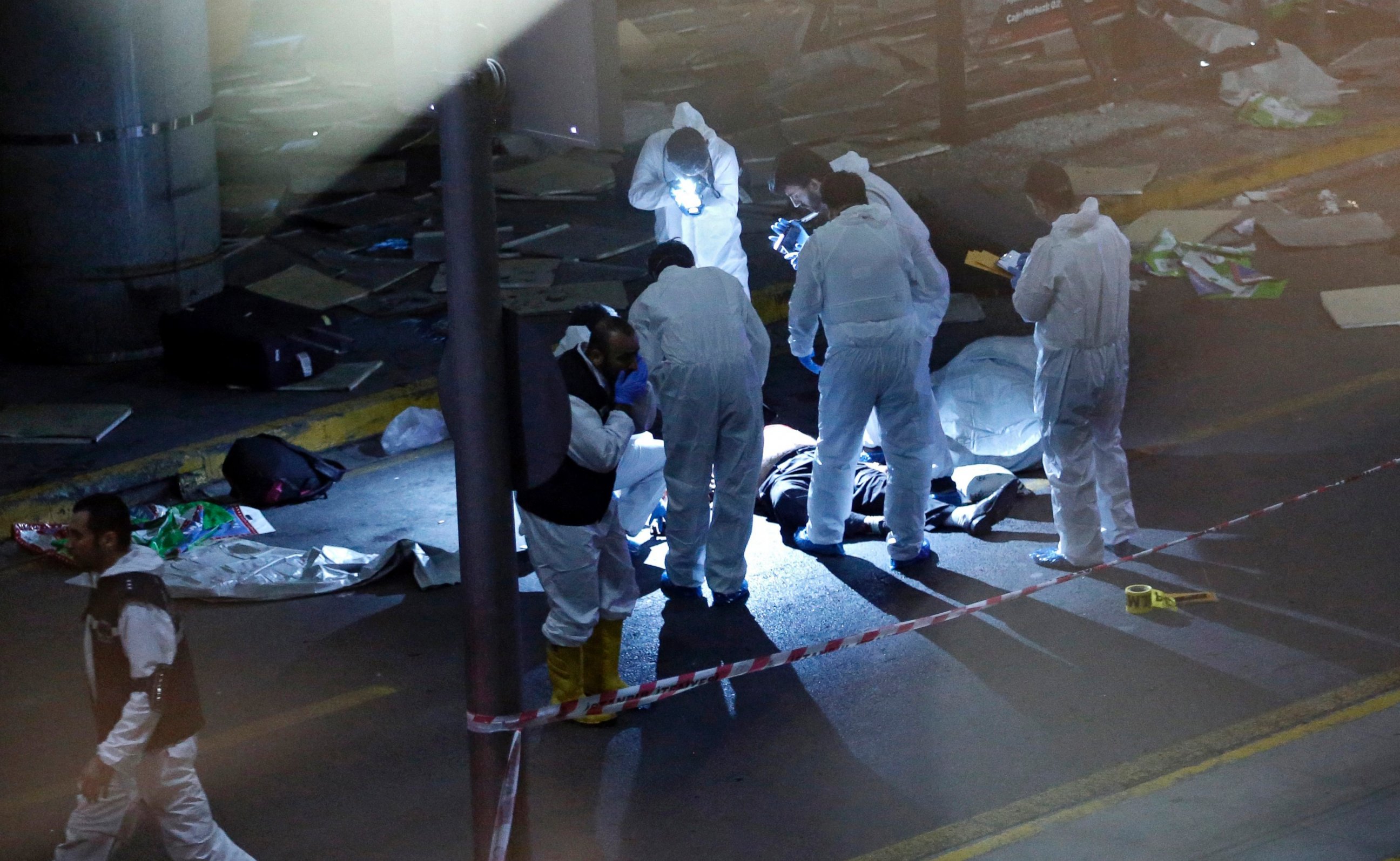 PHOTO: Crime scene investigators work next to a body after an attack at Ataturk Airport in Istanbul, Turkey, June 28, 2016.