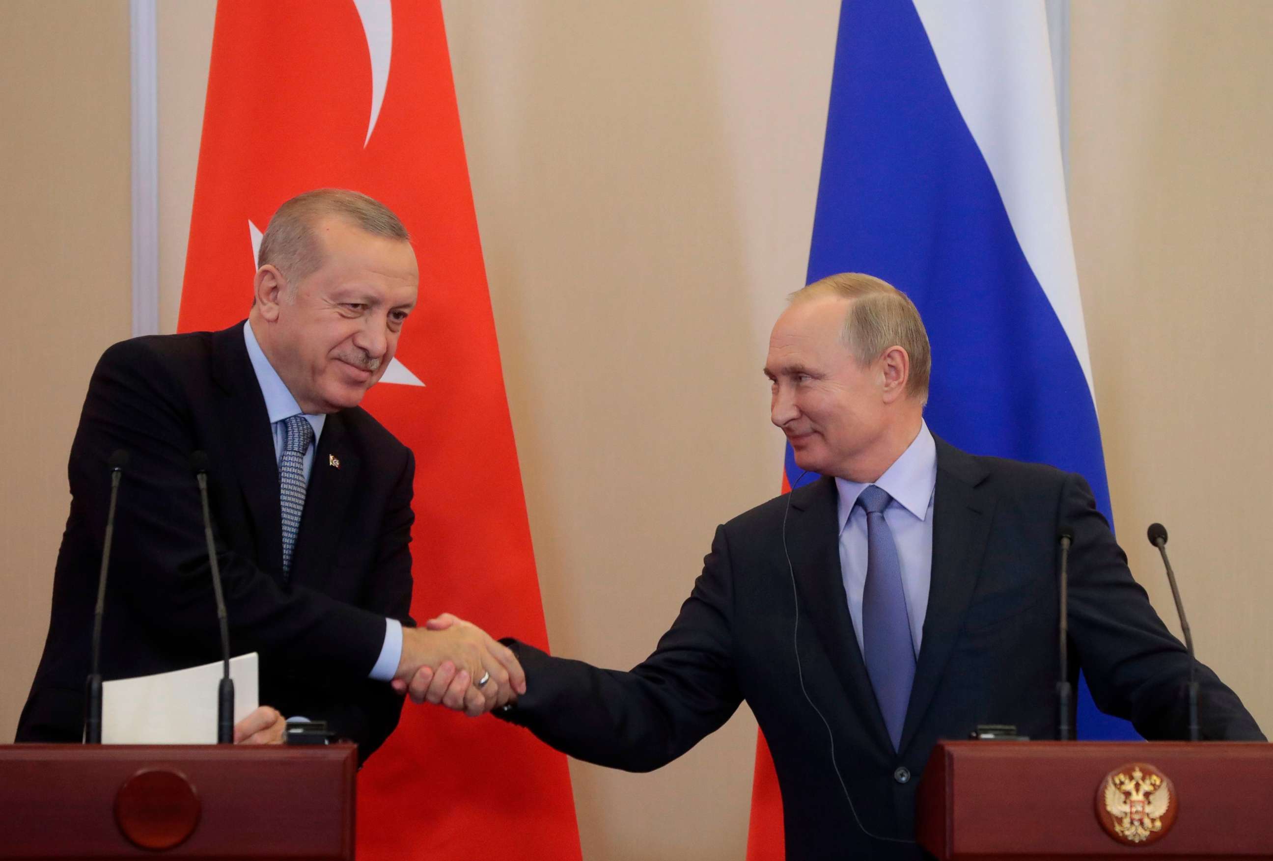 PHOTO: Russian President Vladimir Putin shakes hands with his Turkish counterpart Recep Tayyip Erdogan during a joint press conference following their talks in the Black sea resort of Sochi on Oct. 22, 2019.