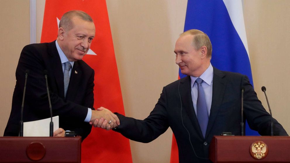 PHOTO: Russian President Vladimir Putin shakes hands with his Turkish counterpart Recep Tayyip Erdogan during a joint press conference following their talks in the Black sea resort of Sochi on Oct. 22, 2019.