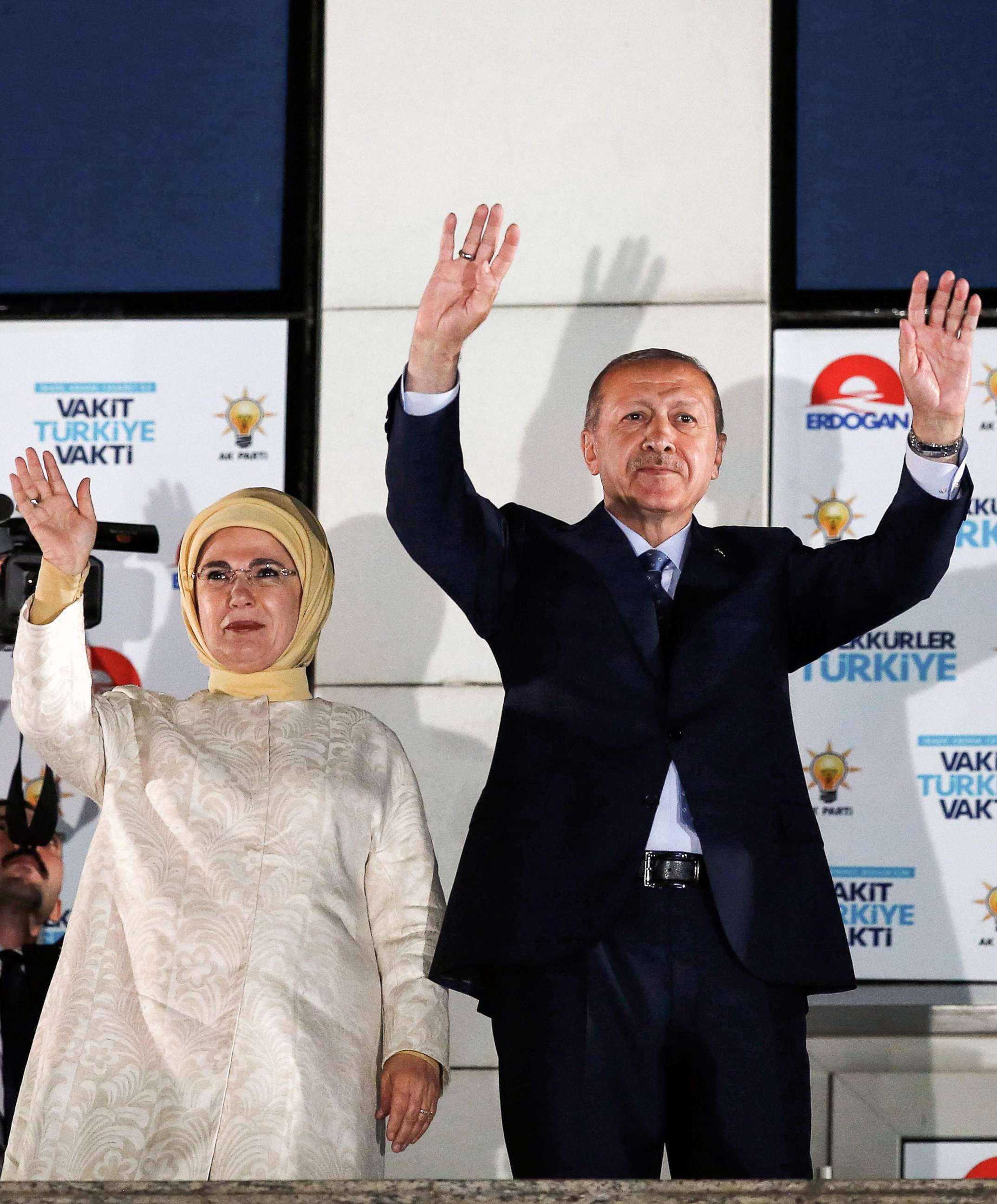 PHOTO: Turkish President Tayyip Erdogan and his wife Emine Erdogan greet supporters gathered above a balcony at the headquarters of the AK Party in Ankara, June 24, 2018 as they celebrate Erdogan winning five more years.