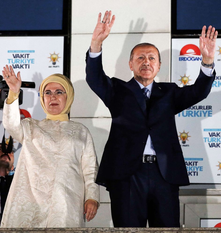 PHOTO: Turkish President Tayyip Erdogan and his wife Emine Erdogan greet supporters gathered above a balcony at the headquarters of the AK Party in Ankara, June 24, 2018 as they celebrate Erdogan winning five more years.