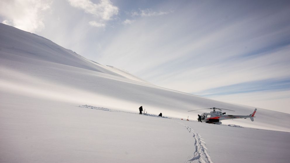 PHOTO: Dr. Graham Hill and Dr. Virginie Maris install a geophysics sensor on the flanks of Mt. Terror in Antarctica. 