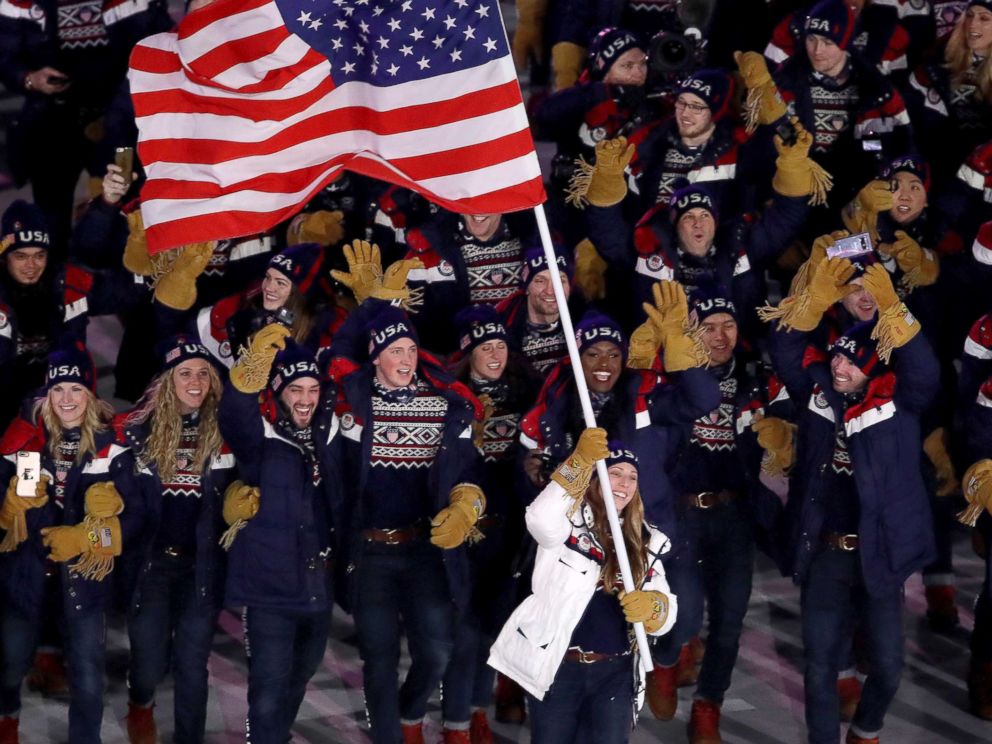 PHOTO: Erin Hamlin carries the flag of the United States during the opening ceremony of the 2018 Winter Olympics in Pyeongchang, South Korea, Feb. 9, 2018.