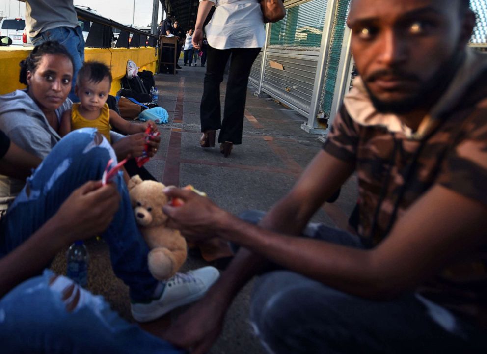 PHOTO: Asylum seekers from Eritrea wait on the Gateway International Bridge connecting Matamoros, Mexico with Brownsville, Texas, to cross into U.S., July 1, 2018.