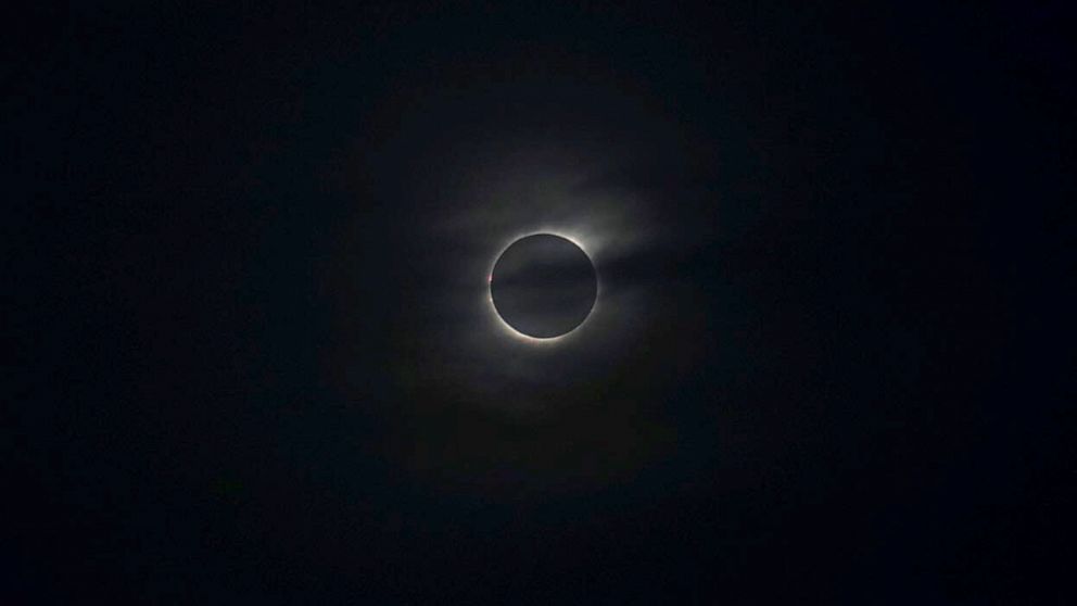 PHOTO: Behind a thin sheet of clouds, the eclipse reaches totality, July 2, 2019, in Cordoba, Argentina.