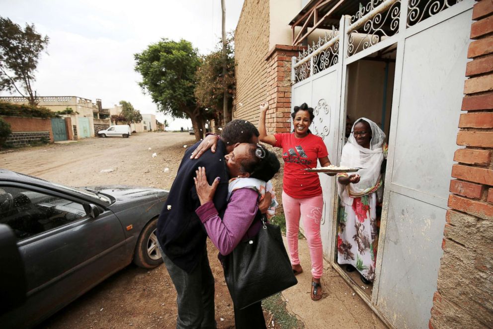PHOTO: Relatives welcome Addisalem Hadgu as they meet for the first time in eighteen years in Asmara, Eritrea, July 19, 2018.