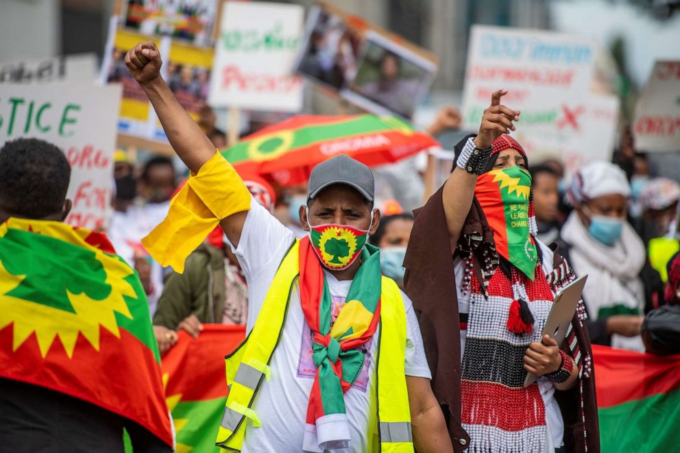 PHOTO: A protestor, wearing a face mask with the flag of the Oromo Liberation Front (OLF), marches during an anti-Ethiopian government demonstration in Berlin on Sept. 4, 2020.