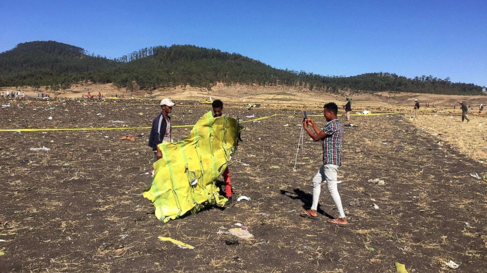 PHOTO: A civilian takes a photograph of the wreckage at the scene of the Ethiopian Airlines Flight ET 302 plane crash, near the town of Bishoftu, southeast of Addis Ababa, Ethiopia, March 10, 2019. 