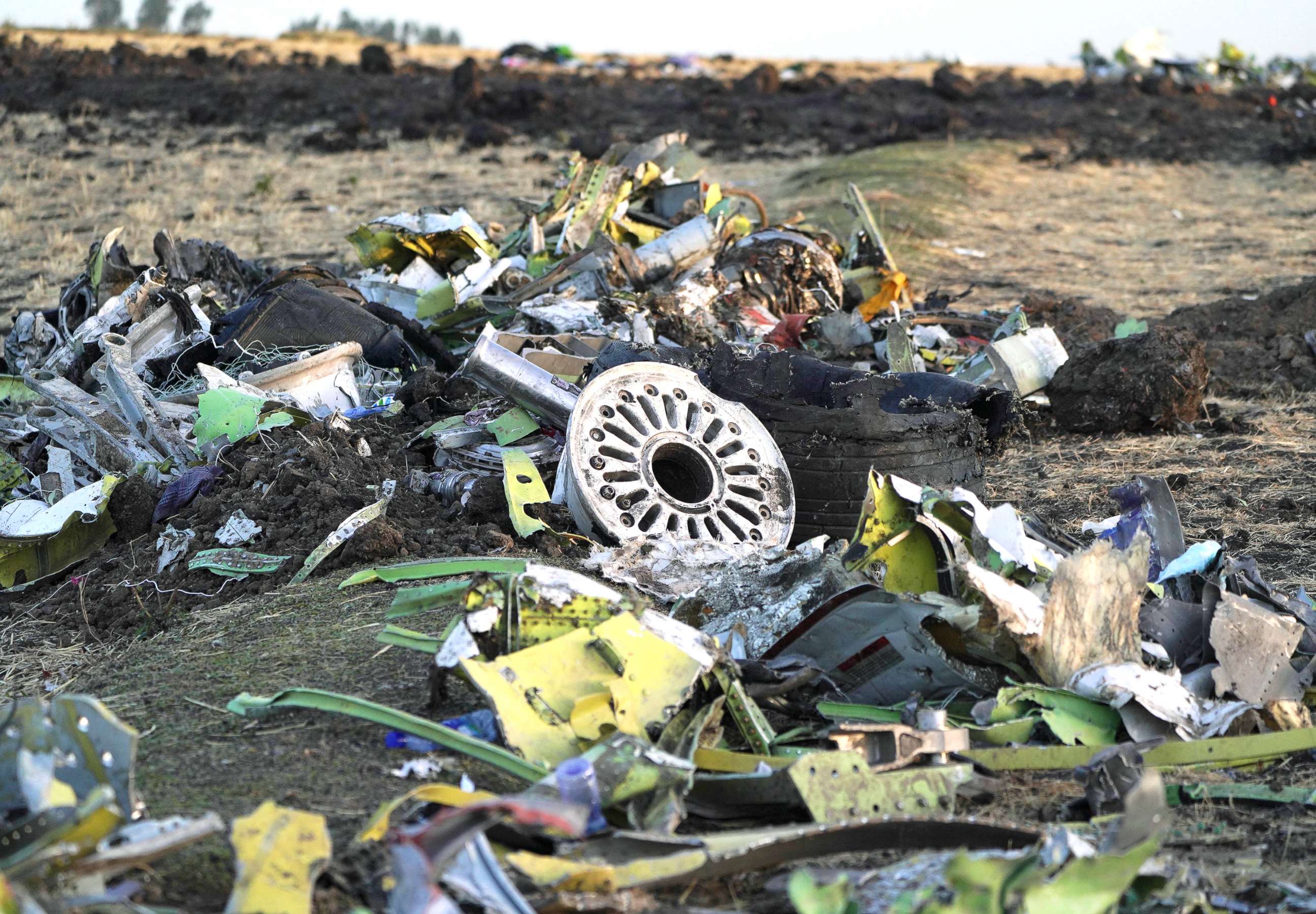 PHOTO: Parts of the landing gear lay in a pile after being gathered by workers during the continuing recovery efforts at the crash site of Ethiopian Airlines flight ET302 on March 11, 2019, in Bishoftu, Ethiopia.