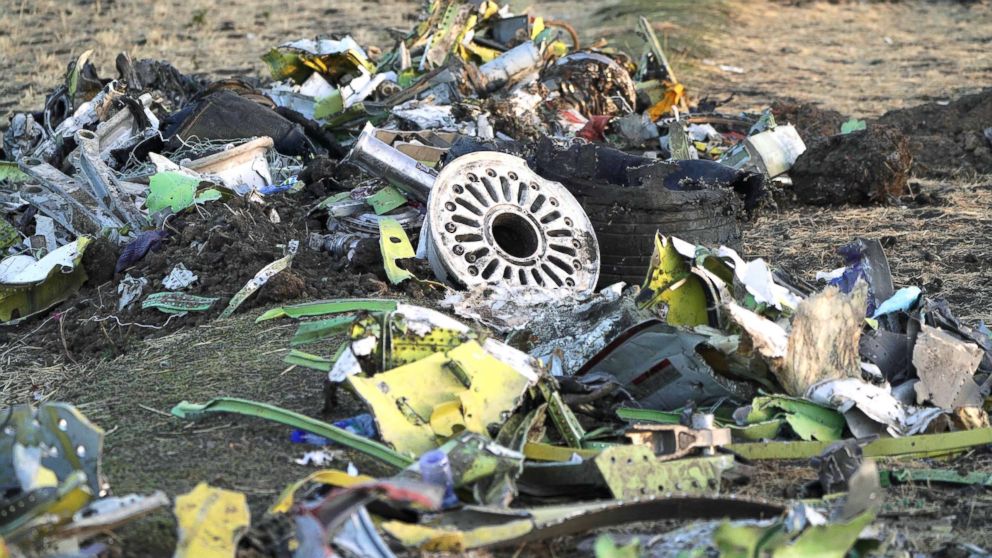 PHOTO: Parts of the landing gear lay in a pile after being gathered by workers during the continuing recovery efforts at the crash site of Ethiopian Airlines flight ET302 on March 11, 2019, in Bishoftu, Ethiopia.