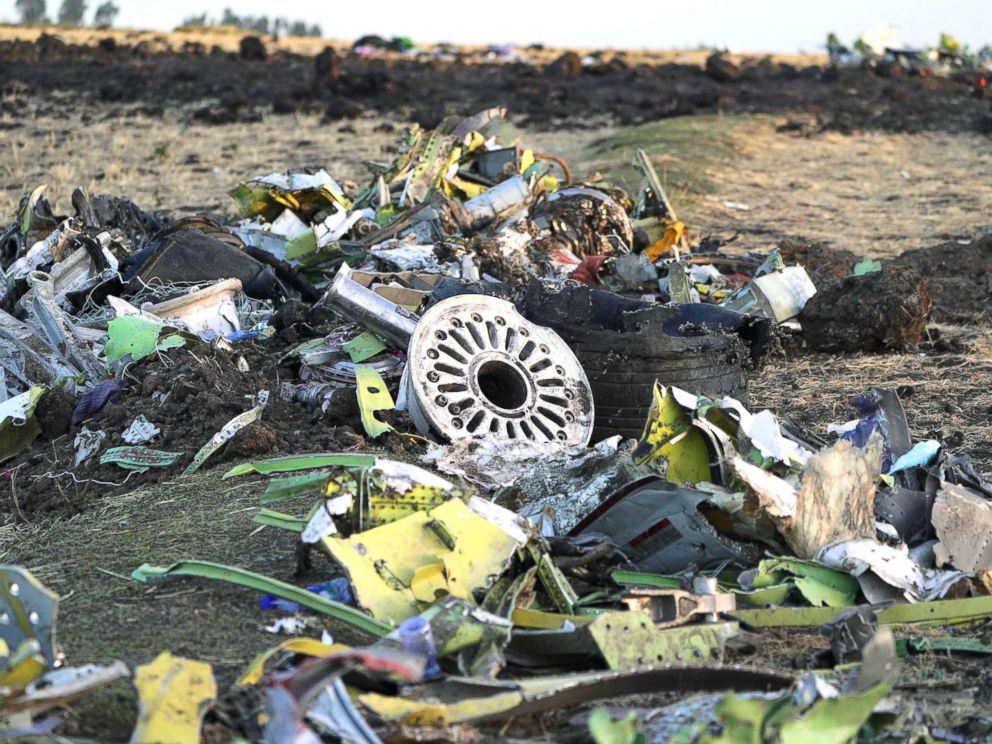 PHOTO: Parts of the landing gear lay in a pile after being gathered by workers during the continuing recovery efforts at the crash site of Ethiopian Airlines flight ET302 on March 11, 2019, in Bishoftu, Ethiopia.