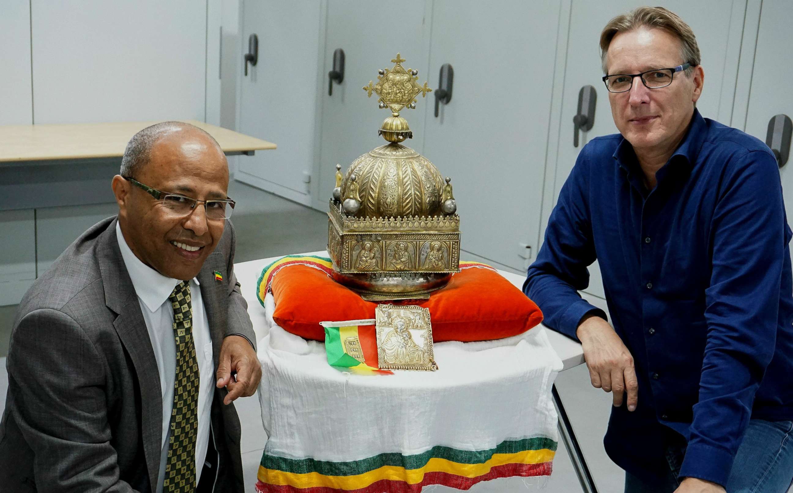 PHOTO: Dutch-Ethiopian Sirak Asfaw and Dutch art detective Arthur Brand pose with an 18th-century Ethiopian crown at an undisclosed high-security storage facility in the Netherlands, Sept. 27, 2019.
