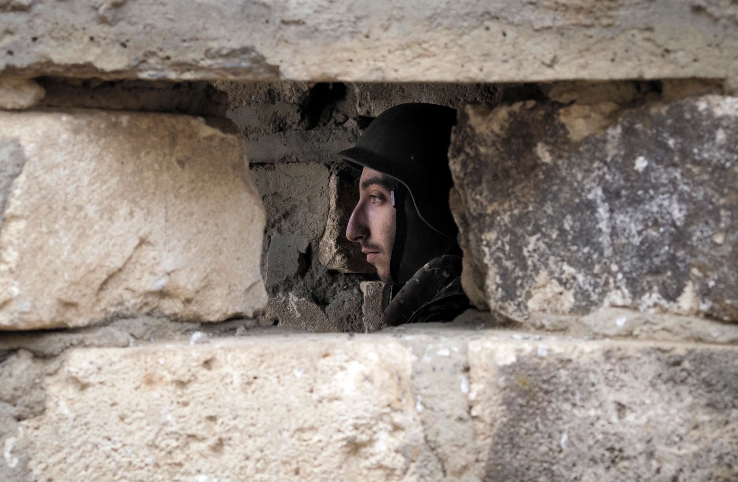 PHOTO: An Ethnic Armenian soldier is seen inside a dugout at a fighting position on the front line, during a military conflict against Azerbaijan's armed forces in the separatist region of Nagorno-Karabakh, Oct. 21, 2020.