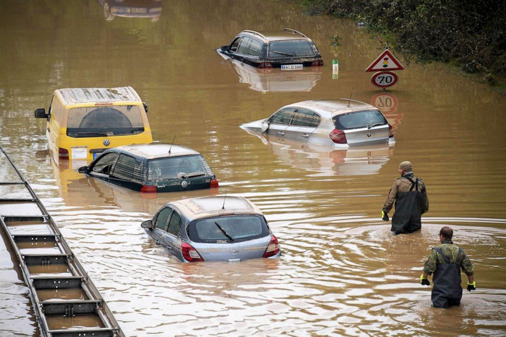PHOTO: Soldiers of the German armed forces Bundeswehr search for flood victims in submerged vehicles on the federal highway B265 in Erftstadt, western Germany, on July 17, 2021.