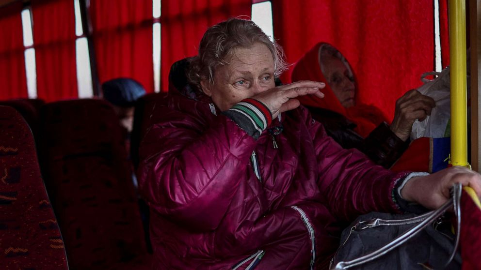 PHOTO: A woman cries after boarding a bus to leave Severodonetsk, in eastern Ukraine's Donbas region, April 13, 2022.