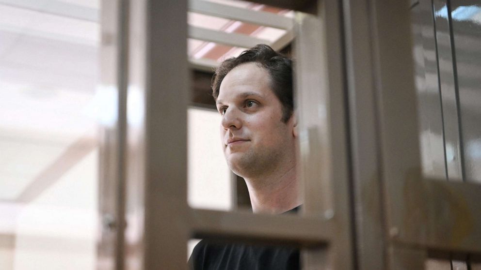 PHOTO: Journalist Evan Gershkovich, arrested on espionage charges, stands inside a defendants' cage before a hearing to consider an appeal on his extended detention at The Moscow City Court in Moscow on June 22, 2023.