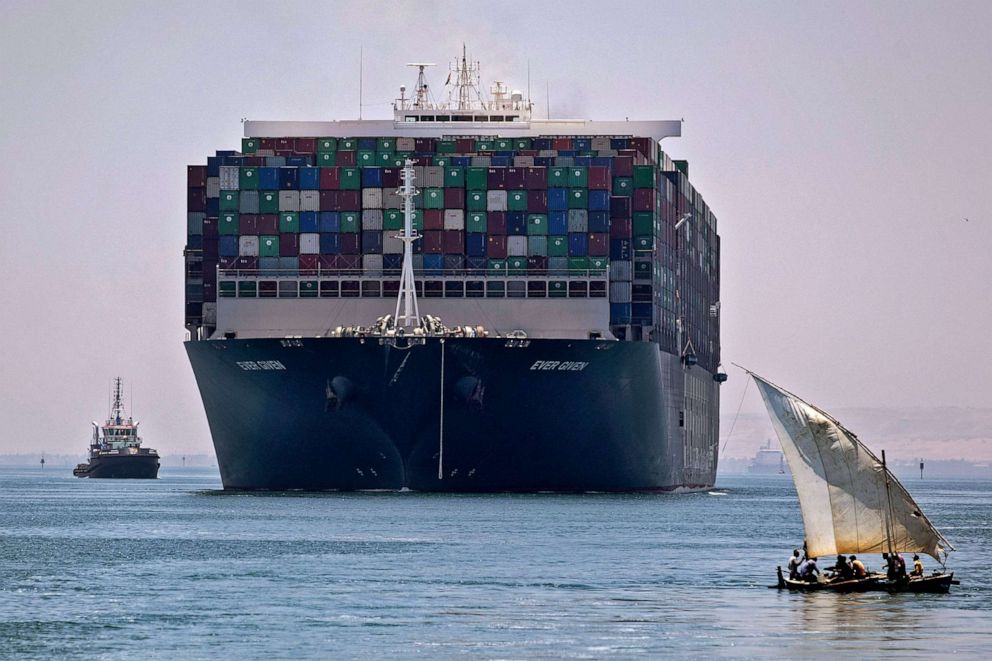 PHOTO: The Panama-flagged MV Ever Given container ship sails near a felucca along Egypt's Suez Canal near the canal's central city of Ismailia, July 7, 2021.
