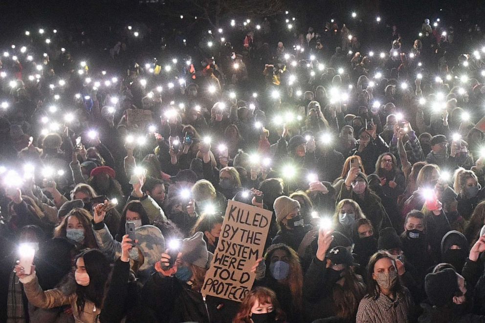 PHOTO: Well-wishers turn on their phone torches as they gather where a planned vigil in honor of murder victim Sarah Everard was canceled after police outlawed it due to COVID-19 restrictions, on Clapham Common, south London, on March 13, 2021.
