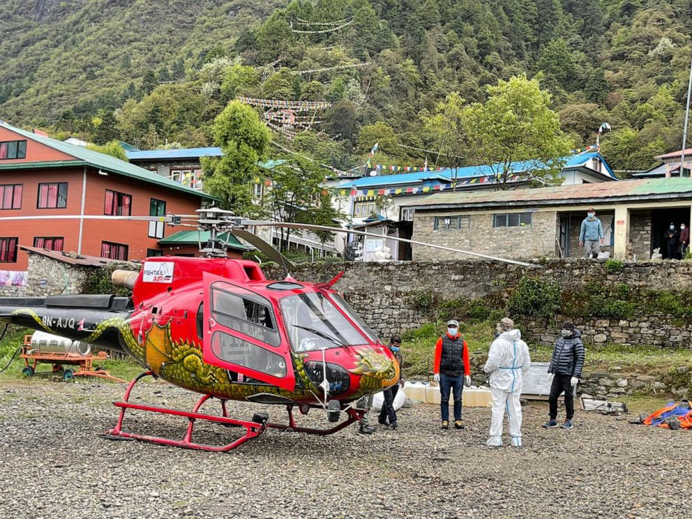 PHOTO: A helicopter evacuation lands in Lukla, Nepal, near Mount Everest, in May, 2021.