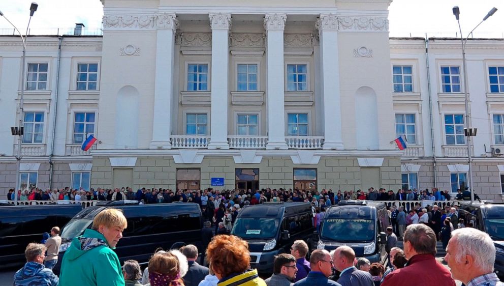PHOTO: In this grab taken from a footage provided by the Russian State Atomic Energy Corporation ROSATOM press service, people gather for the funerals of five Russian nuclear engineers killed by a rocket explosion in Sarov.