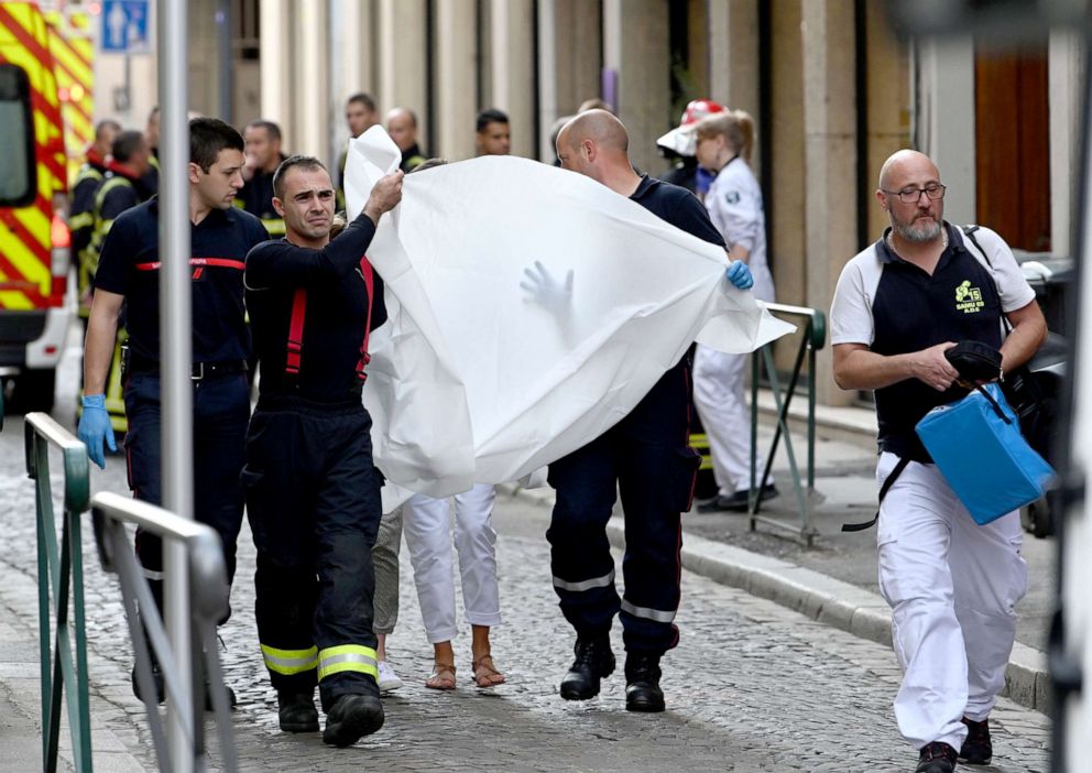 PHOTO: Emergency workers carry a person injured in suspected package bomb blast along a pedestrian street in the heart of Lyon, southeast France, the local prosecutors' office said, May 24, 2019.