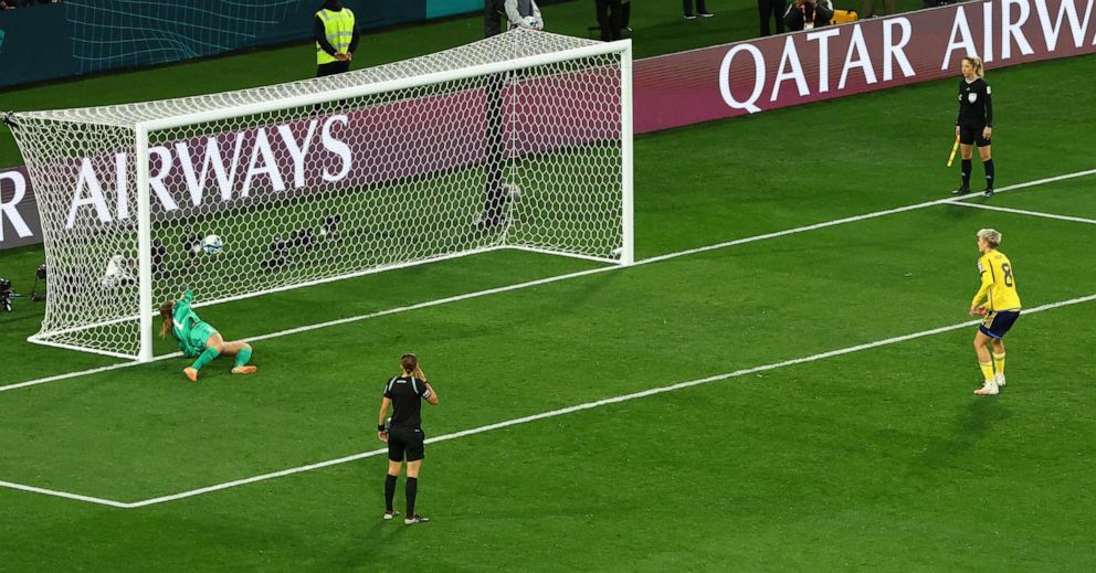 PHOTO: Alyssa Naeher of the U.S. attempts to save a penalty from Sweden's Lina Hurtig during the penalty shootout as the ball crosses in Melbourne, Australia, on August 6, 2023.