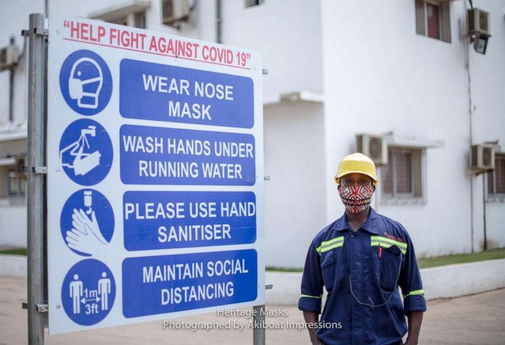PHOTO: A Fabrimetal Ghana employee is seen wearing a protective face mask, made by Heritage Masks, at the company’s office in the city of Tema, about 20 miles outside Accra, Ghana, in May 2020.