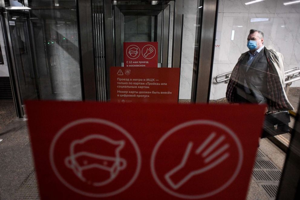 PHOTO: A man wearing a face mask walks at Savyolovskaya metro station in Moscow, Russia, on May 12, 2020, on the first day of mandatory use of masks and gloves on Moscow public transportation amid the coronavirus pandemic.