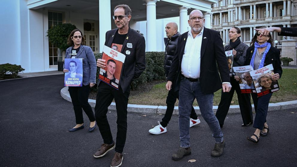 PHOTO: Orna Neutra (left) and Ronen Neutra (second left), parents of Omer Neutra, make a statement with other families of Americans being held hostage by Hamas in front of the West Wing after a meeting with administration officials, on Nov. 12, 2024.