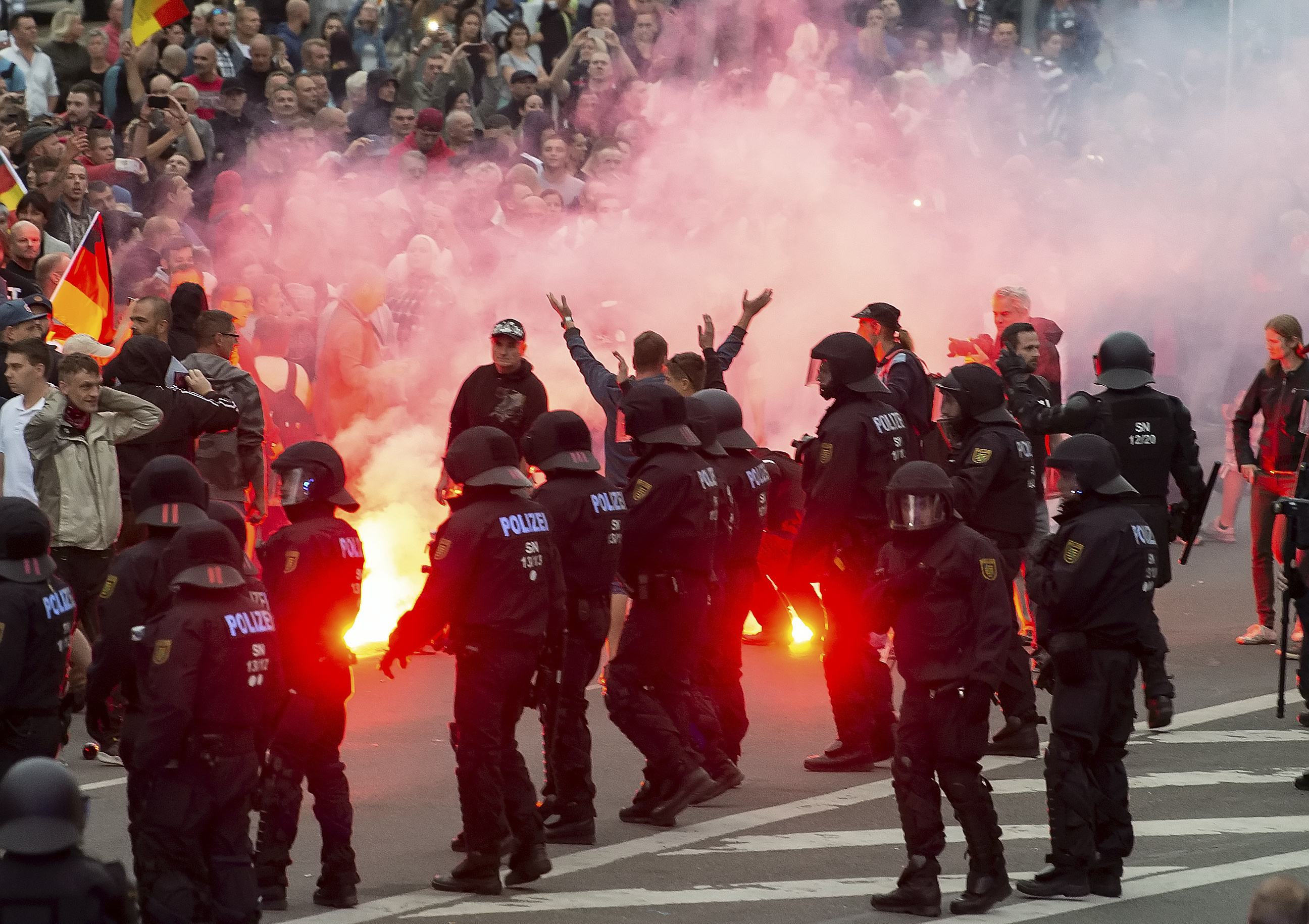 PHOTO: Protesters light fireworks during a far-right demonstration in Chemnitz, Germany, Aug. 27, 2018.