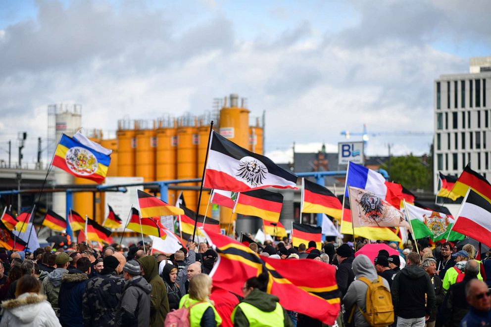 PHOTO: Far-right protestors hold Reichskriegsflaggen, the German Nationa Flag and Wirmer Flags at Berlin Central Station on German Unity Day on Oct. 3, 2019 in Berlin.