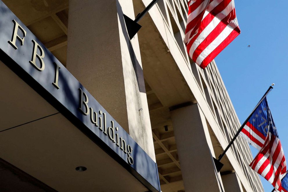 PHOTO: Flags fly on the FBI headquarters building in Washington, Dec. 7, 2018.