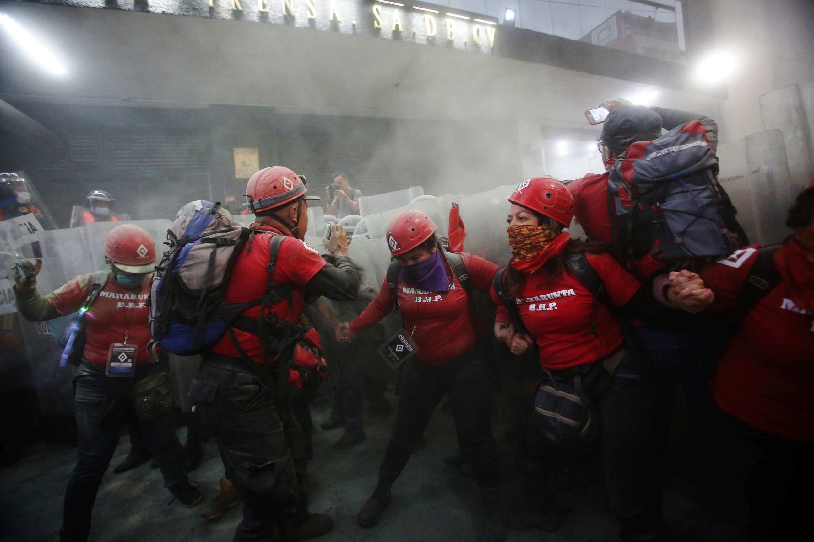 PHOTO: Members of the Marabunta Brigade try to stop police from attacking demonstrators during a protest against gender violence in Mexico City, Feb. 14, 2020.