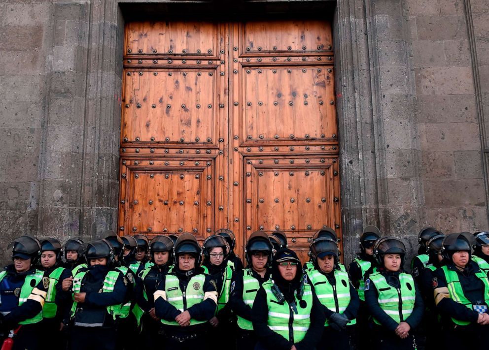 PHOTO: Mexican riot police guard the National Palace during a demonstration against gender violence in Mexico City, Feb. 18, 2020.