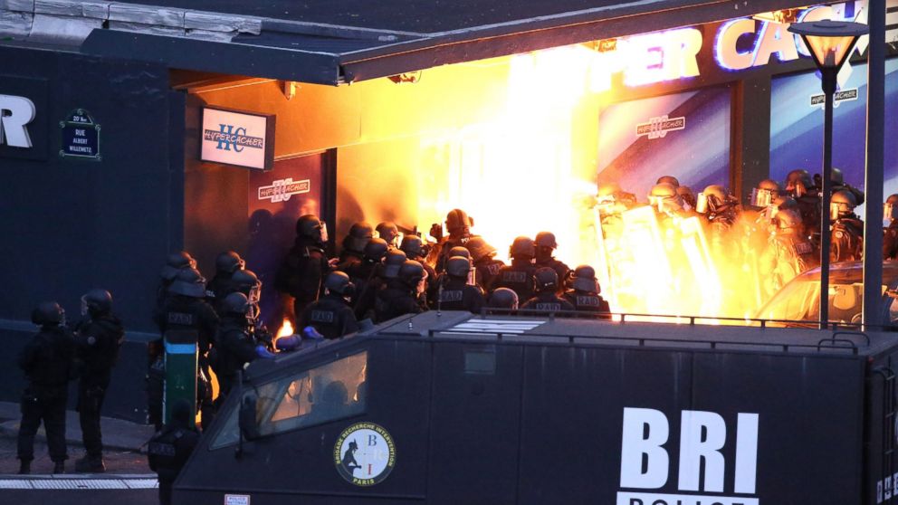 Police forces storm the Hyper Cacher kosher grocery store in Porte de Vincennes, eastern Paris,  Jan. 9, 2015. 