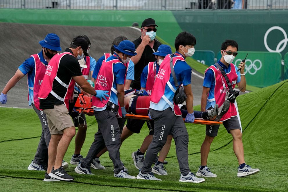 PHOTO: Medics carry away Connor Fields of the United States on a stretcher after he crashed at the first bend in the men's BMX Racing semifinals at the 2020 Summer Olympics, Friday, July 30, 2021, in Tokyo, Japan.