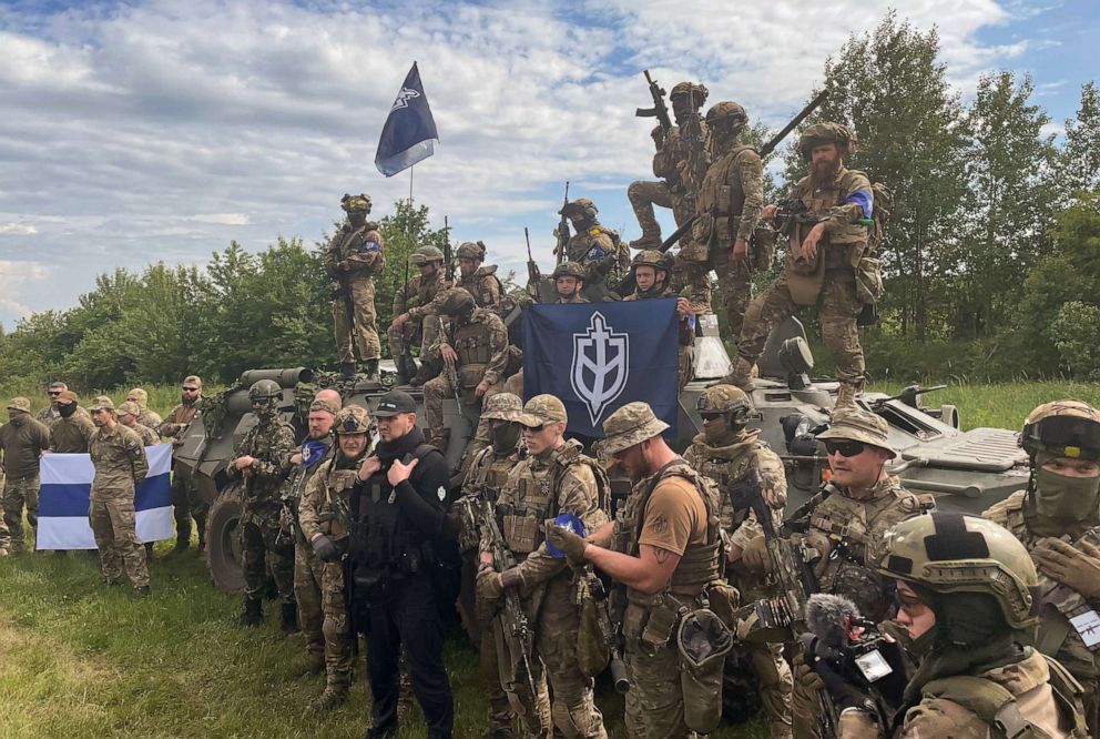 PHOTO: Fighters with the paramilitary groups that identify themselves at the Russian Volunteer Corps and the Free Russia Legion, meet with members of the press in northern Ukraine, near the Russian border, May 24, 2023.