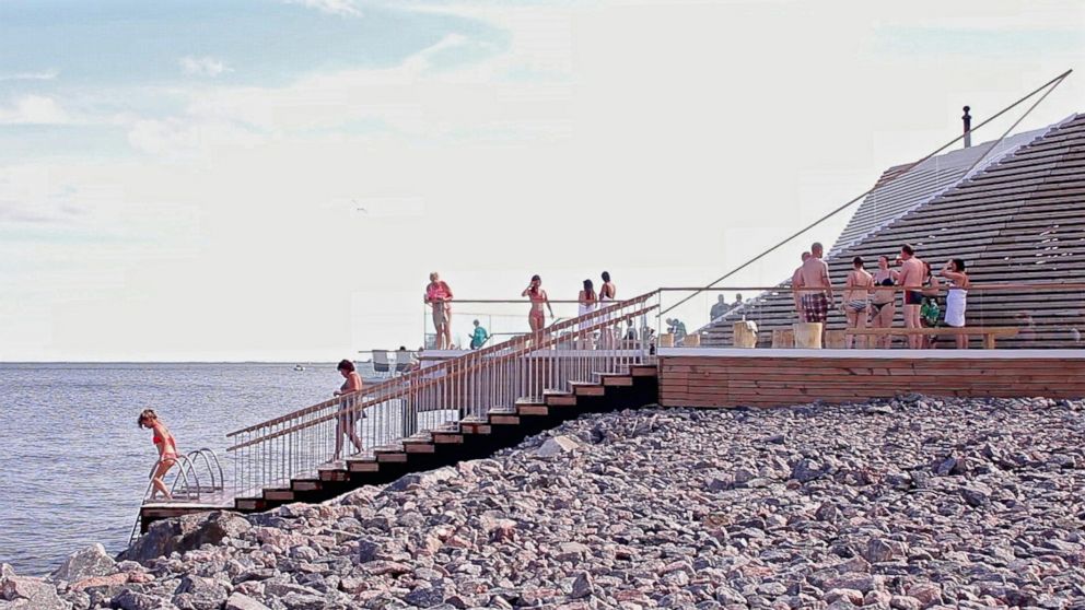 PHOTO: Sauna-goers dip in the Baltic Sea at a boutique sauna called Loyly in Helsinki, Finland, on July 7, 2016.