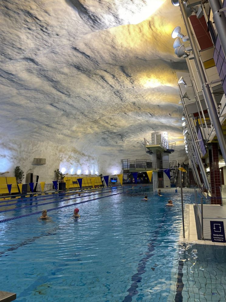 PHOTO: Swimmers relax in an underground pool in Helsinki, Finland. All buildings above a certain size in Finland are required by law to have their own bunkers.