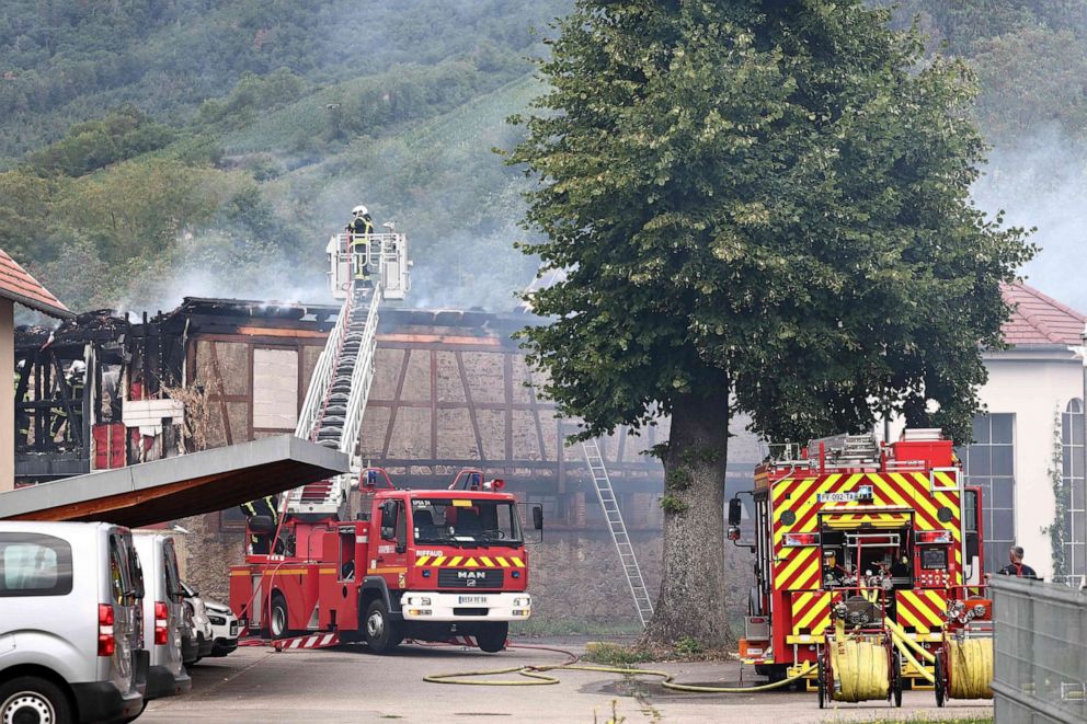 PHOTO: Firefighters work to extinguish a fire which erupted at a home for disabled people in Wintzenheim near Colmar, eastern France, on Aug. 9, 2023.