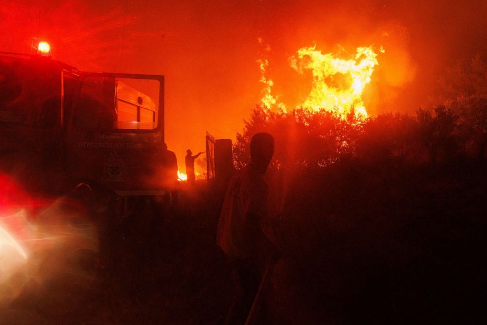 PHOTO: Firefighters try to extinguish the flames in a forest in Avantas village, near Alexandroupolis town, in the northeastern Evros region, Greece, Aug. 21, 2023.
