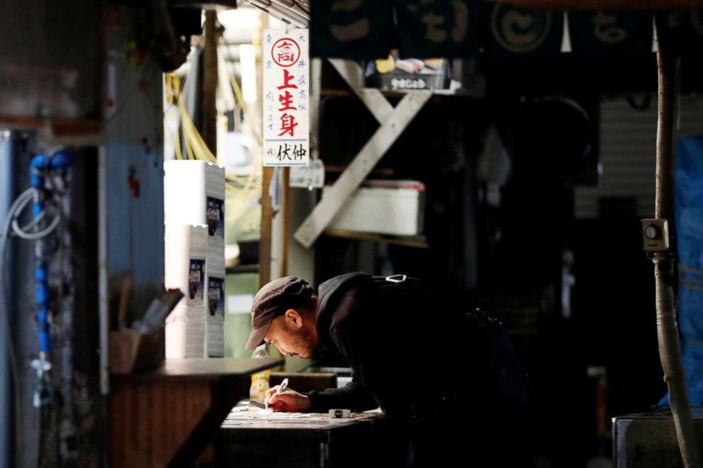 PHOTO: A wholesaler writes the days sales figures after trading ends at the Tsukiji fish market in Tokyo, Sept. 27, 2018.